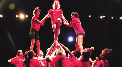 The Lady Eagles competition cheer team practices pyramid movement.