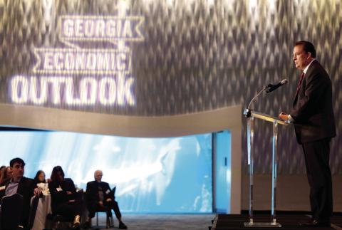 Dean Ben Ayers delivers the state of the Georgia economy during the Georgia Economic Outlook presented the Terry College of Business at the Georgia Aquarium on Friday. PHOTO BY RICHARD HAMM/UGA
