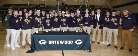 Members of the Gatewood baseball team were introduced during halftime Jan. 23 at the Gators basketball game as each was officially presented their 2023 GIAA Class AA state championship rings by head coach Brandon Moss (far right). Several players who have since graduated from Gatewood’s high school returned from various colleges to Eatonton for the ceremony and the team received an enthusiastic welcome from the hoops crowd. IAN TOCHER/Staff