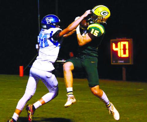 Lawson Wooten (15) goes up to make the catch for Gatewood that extended their lead late in the first half. IAN TOCHER/Staff