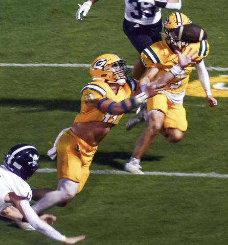 Mason Sinclair (11) recovered this fumble by the Southland player (lower left) near the Gators' end zone in the second quarter last Friday night. (IAN TOCHER/Staff)