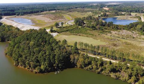 2018 aerial view of two ponds on the Plant Branch site north of Milledgeville. Lake Sinclair is in the foreground. MARK ENGEL/File photo