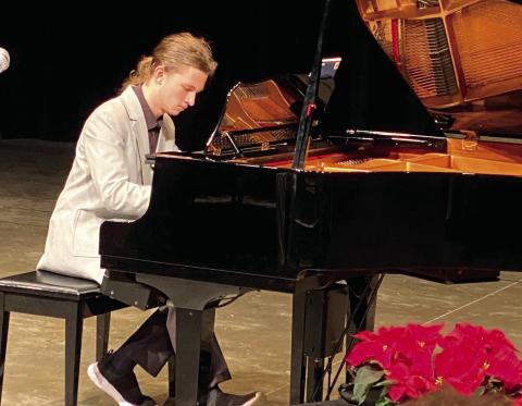 Mark Pinchukov played “Bohemian Rhapsody” during his recital Dec. 12 at Putnam County High School. Scan the QR code to watch his performance. VICTORIA ANADENKO/Staff