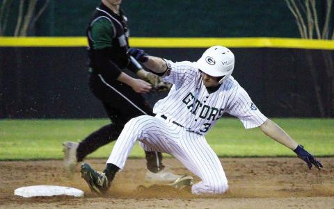 Gatewood’s Walker Roberts slides into second in a game played earlier this season in Eatonton. TREY NORRIS/Staff