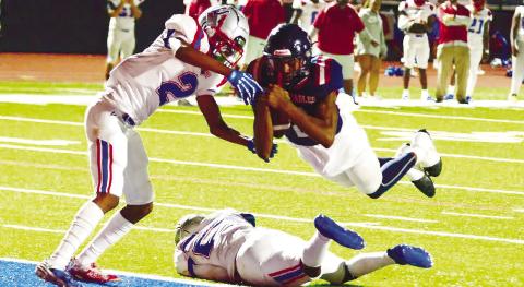 Putnam County quarterback Jamarion Robertson dove across the goal line in the fourth quarter to score a two-point conversion last Friday in a 28-15 win over Westside. IAN TOCHER/Staff