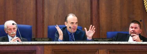 District 2 Commissioner Richard Garrett makes a point during the Aug. 7 meeting, with District 3’s Steve Hersey (left) and Tom McElhenney of District 1 listening. District 4 Commissioner Jeff Wooten was absent. IAN TOCHER/Staff