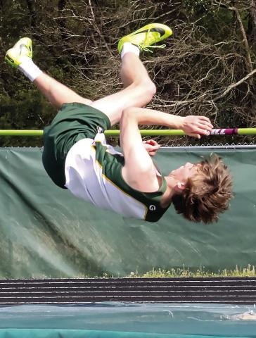 Blake Callaway attempts to jump over the bar during the high jump event at a meet earlier this season. LANCE MCCURLEY/Staff