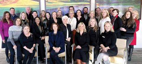 Members of the Heart and Soul Gala Committee, including event chair Riezl Baker (far left), pose with members of the Reynolds Properties team in the operating room waiting area at St. Mary’s Good Samaritan Hospital. CONTRIBUTED