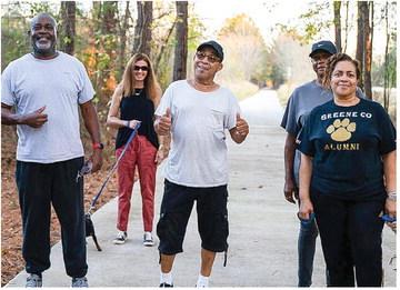 A group of pedestrians enjoys a walk on the Firefly Trail. CONTRIBUTED