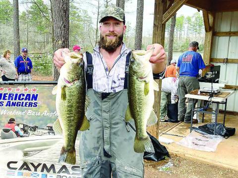 Sam Montgomery of Milledgeville shows off some of his catch that earned him a win early this month in the American Fishing Tour Div. 72 tournament on Lake Sinclair. CONTRIBUTED