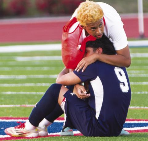 Putnam County’s Jonathan Acostas (9), who scored the War Eagles’ lone goal in their Elite Eight matchup, is comforted by a teammate following the loss to Barrow Arts &amp; Sciences Academy. SKYLA MORRIS/Staff
