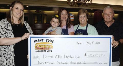 L-R: Rebecca Wilson, daughter of Darren Alford; Barrett and Kierston Tuel, owner of Giant Subs and Oconee Wild Watersports; Cathy Tuel, manager of Giant Subs, and Terry Tuel. IAN TOCHER/Staff