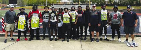 Putnam County football players and coaches pose for a photo following the MVP Camp on Sunday at Milton High School in the northern suburbs of Atlanta. CONTRIBUTED