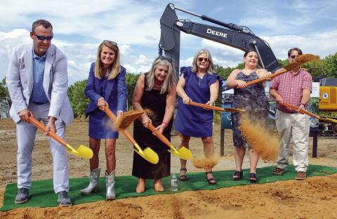 Josh and Lauren Sprayberry (left) were joined by family members in a ceremonial groundbreaking last Thursday for the Len Resort &amp; Residences, slated for completion in May 2026 on the Putnam County shores of Lake Oconee. IAN TOCHER/Staff