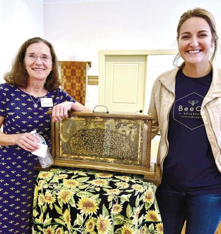 BeeCo Apiaries’ Mary Lacksen (left) and her daughter-in-law Caroline Lacksen exhibit a live honeybee hive during their visit to Eatonton’s Old School History Museum last Sunday. CONTRIBUTED