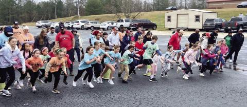 Chairperson Linda Elkins said the kids’ Fun Run is always one of her favorite moments of the annual Ferst Readers’ Seuss on the Loose event at Putnam County Primary School. CONTRIBUTED
