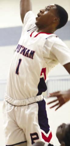 Putnam County's Eren Banks (1) goes up for a layup. LANCE MCCURLEY/Staff