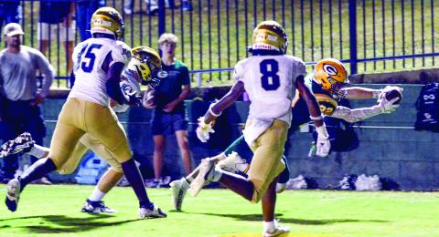 Gatewood running back Hunter Johnson (22) dives into the end zone and scores a touchdown during a game last season. IAN TOCHER/Staff
