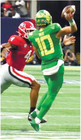Senior linebacker Nolan Smith (4) chases after Ducks’ quarterback Bo Nix (10) as he scrambles out of the pocket and toward the right sideline. BRENDAN KOERNER/Staff