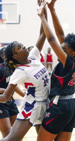 Junior Jaikarccie Smith plays defense against Morgan County. IAN TOCHER/Staff