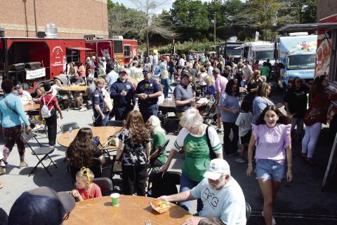 Long lines were the order of the day at several food trucks lined up near the entrance to The Big Event last Saturday at Lake Oconee Village. IAN TOCHER/Staff