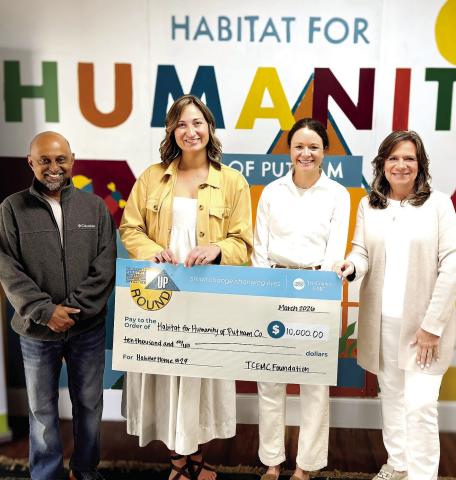 L-R: Habitat for Humanity of Putnam Executive Director Murali Thirumal, Tri-County EMC Communication Specialist Anna Smith, HFHP Marketing &amp; Development Manager Katherine Mahlberg, and HFHP Board Chair Linda Moore at a check presentation last Thursday. CONTRIBUTED