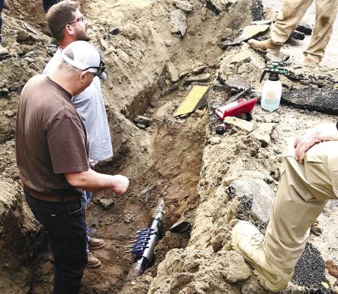 Colby Andrews and Jay Andrews with C&amp;H Pipeline work on the repair of the four-inch gas main that was struck by a contractor. CONTRIBUTED