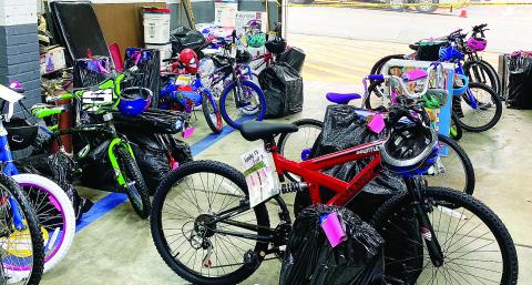 Last year’s Fireman Santa gifts for about 200 City of Eatonton kids nearly filled the garage area in the Eatonton Fire Department building on West Marion Street. EFD Chief Jamey Williamson said he hopes to deliver even more Christmas gifts to local kids this year. CONTRIBUTED