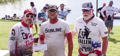 Mike Tarrer of Georgia Bass Trail along with tournament winner John Duvall and Oskar Schlomer of The Fallen Outdoor group. CONTRIBUTED