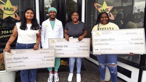 Dr. Willie Oliver congratulated (l-r) Putnam County High School graduates Regina Aspen, Makayla Todd, and Lauren Oliver as recipients of his $1,000 Most Valuable Smiles scholarships, as each will begin attending various universities this year. IAN TOCHER/Staff