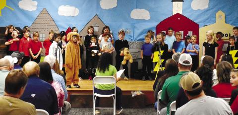 First-grade Gatewood students present their Weather Show to families and friends. LENA HENSLEY/Staff