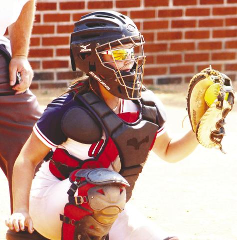 Addison Hutsell catches behind the plate for Putnam County. ARELLA CASH/Staff