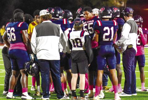 Putnam County players discuss the game plan during a timeout against Thomson on Oct. 20. CHARLES JORDAN/Staff