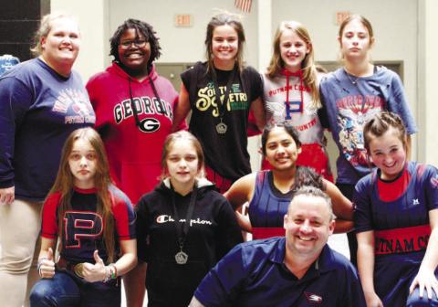 Putnam County High School’s Lady War Eagles were in Harris County Jan. 16, honing their wrestling skills in the annual Queen of the County tournament.