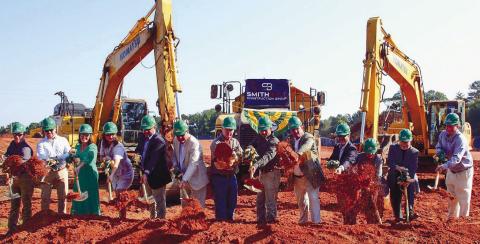 Representatives of Gatewood Schools, including Headmaster Jeff Decker, Assistant Headmaster Josh Ringer and Director of Development Marie Rainey, among others, joined several local officials in tossing a ceremonial shovelful of dirt for the official groundbreaking of Gatewood’s new high school. IAN TOCHER/Staff