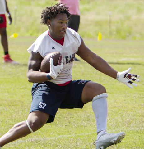 Putnam County junior running back Elijah Dunn goes through a drill during a spring practice in May. LANCE McCURLEY/Staff