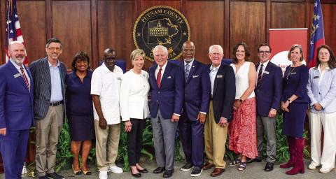 Members of Georgia Humanities posed with panelists Cathy Cox, Gov. Nathan Deal, and Legislator Calvin Smyre shortly before their discussion on democracy and the current condition of state and federal politics took place. IAN TOCHER/Staff