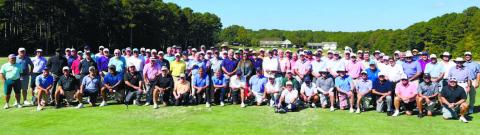 Jennifer Vaughan of Ansley Real Estate Christie’s International (center) is surrounded by the entire playing field for the Georgia Senior PGA at Reynolds Lake. CONTRIBUTED