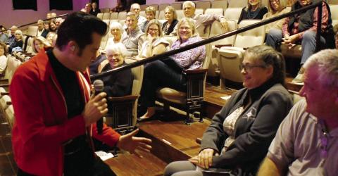 Travis LeDoyt, performing as Elvis Presley, worked the audience all night at The Plaza Arts Center, including a visit to the balcony where he serenaded several grateful Elvis fans. IAN TOCHER/Staff