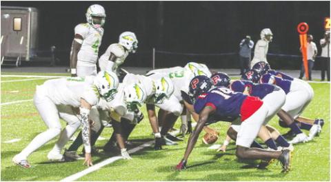 Josey quarterback Altravion Simpkins lines up the Eagles' offense against Putnam County in last year's game at Al Reaves Field in Eatonton. LANCE MCCURLEY/Staff