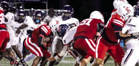 Social Circle running back Kayden Fears (31) fights his way through Putnam County defenders as he tries to score a touchdown. Courtesy of Brendan Koerner