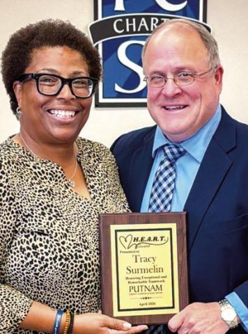 H.E.A.R.T Award recipient Tracy Surmelin poses alongside Assistant Superintendent Scott Sauls. “I am definitely one to say that I am Putnam Proud,” Surmelin said when accepting the award. ALIVIA BLANTON/Staff