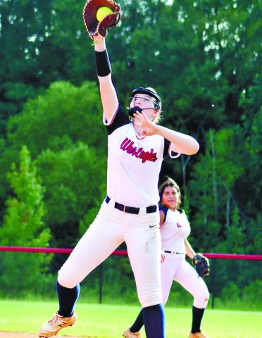 Sam Spisak gets tall while keeping toe on the bag for out at first.