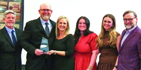 E-PCOC President Robbie King (far left) and Peoples Bank President Chuck Haley (far right) presented the 2026 Business of the Year Award to Keith Fitzgerald, founder and owner of ProSouth Services Electrical-Heating and Air, with his family. IAN TOCHER/Staff