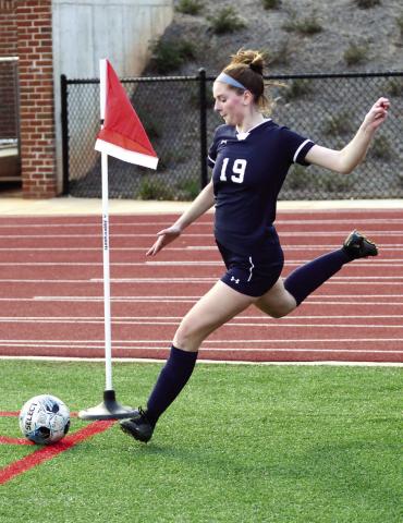 Putnam’s Elizabeth Haley (19) makes a corner kick toward the Westside-Augusta goal last Thursday night. IAN TOCHER/Staff
