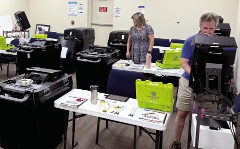 Under the watchful eye of Putnam County Elections Supervisor Kim Rudolph (not shown), three new local elections workers were receiving training last Friday afternoon at the county administration building. IAN TOCHER/Staff