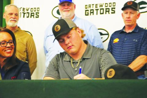 Gatewood Blake Daniel signs with Emmanuel College at a ceremony earlier this month. CONTRIBUTED