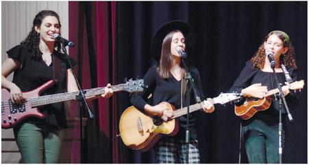 Sisters Helen, Elisa and Lily Garcia-Carreras of Evergreene perform on The Plaza stage. IAN TOCHER/Staff