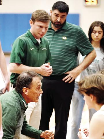 Gatewood head coach Don Keiser (left, crouching) attempts to rally his team in what turned out to be a disappointing 67-57 loss to Brentwood last Saturday at Tatnall Square Academy. BOB BETZEL/Contributed