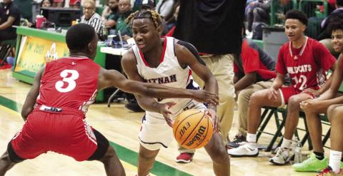 Putnam County senior Landon Bonner (2) tries to drive past a Laney defender. Bonner scored the team’s second-best 25 points in the loss to the Wildcats last week. LANCE McCURLEY/Staff
